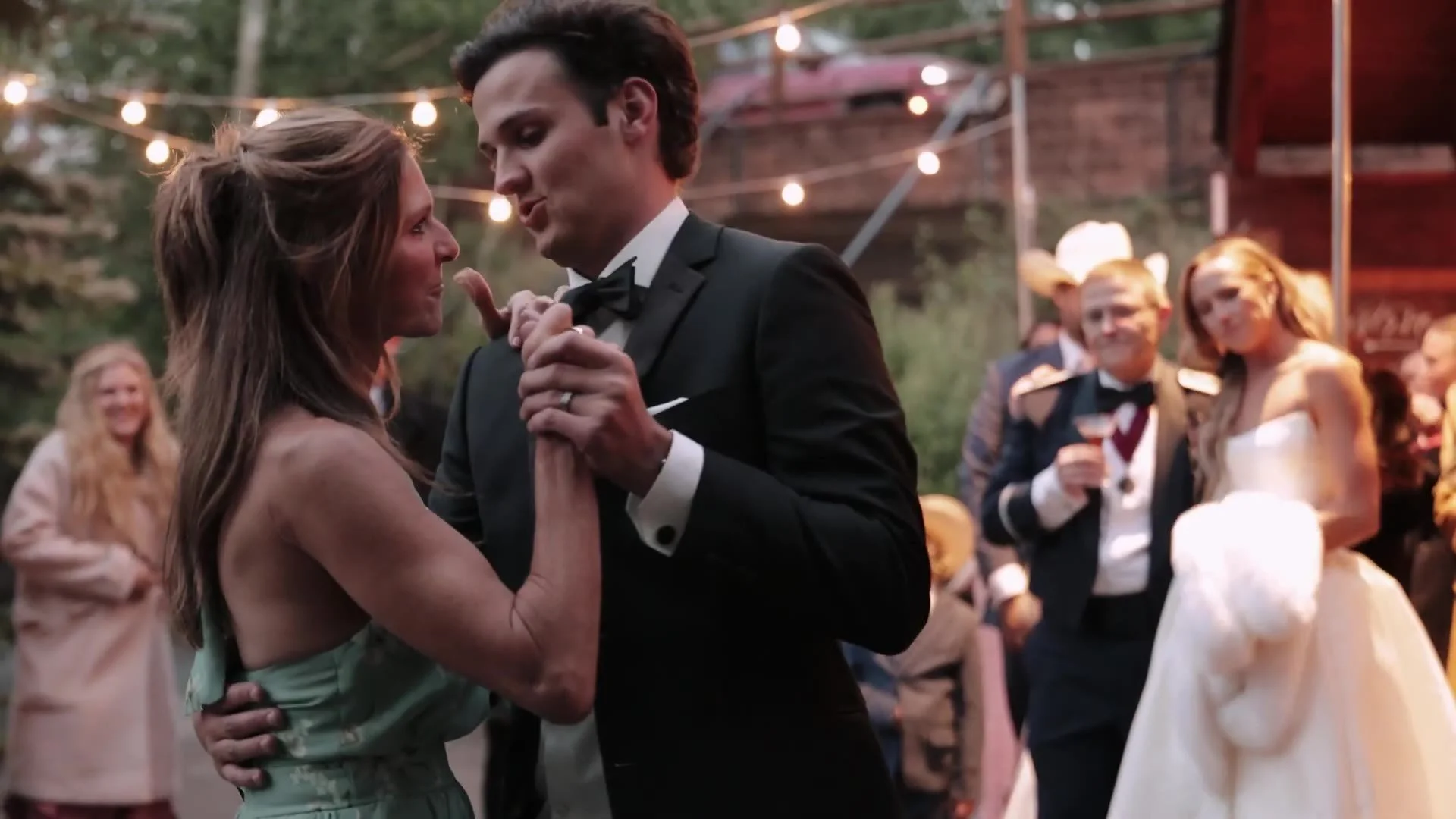 Guests dancing under string lights at a Crested Butte Wedding Garden reception in Colorado