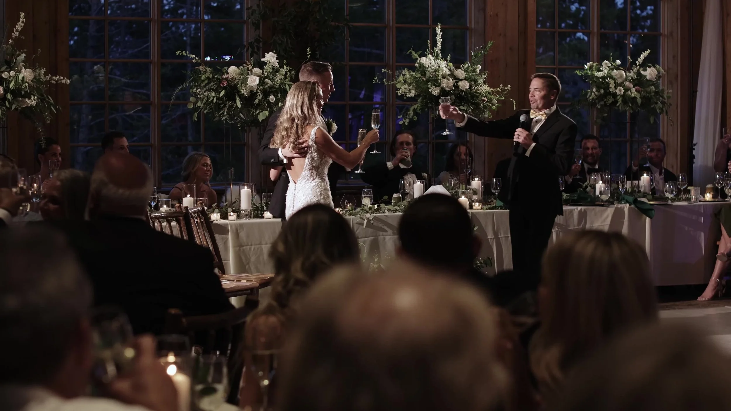 Toast at the head table during Caitlin and Matthew's Breckenridge Colorado wedding reception