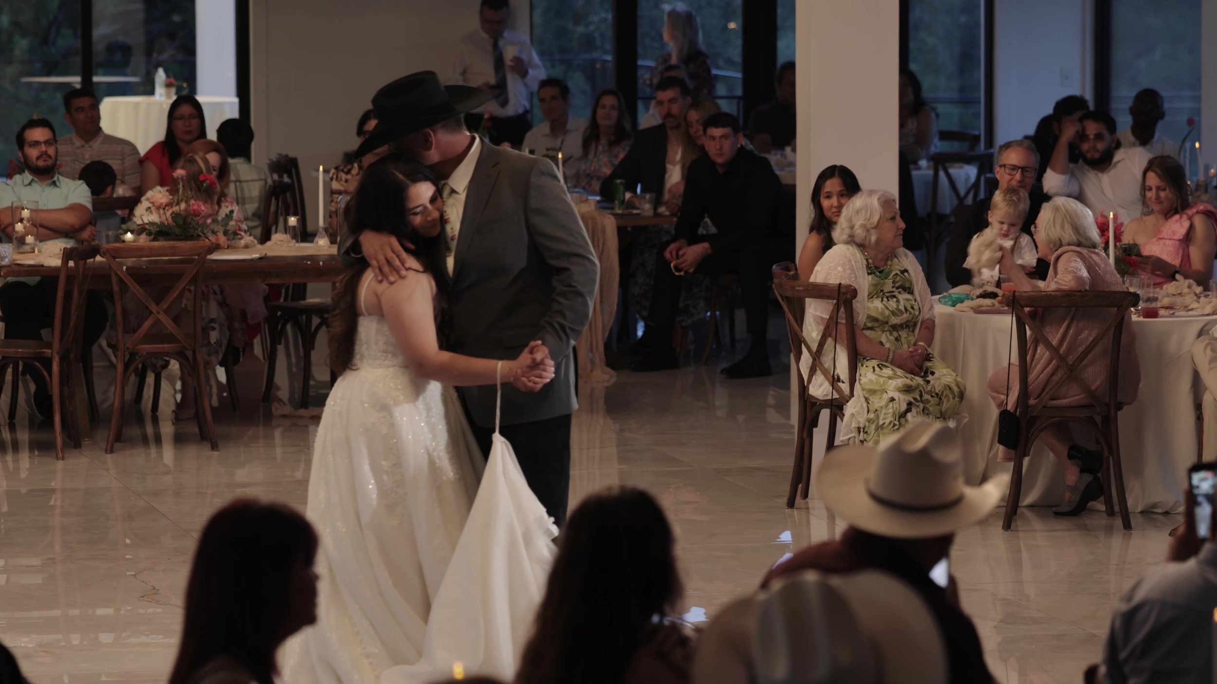 Peter and Kiyara first dance wide in the reception hall at Videre Estate near Austin