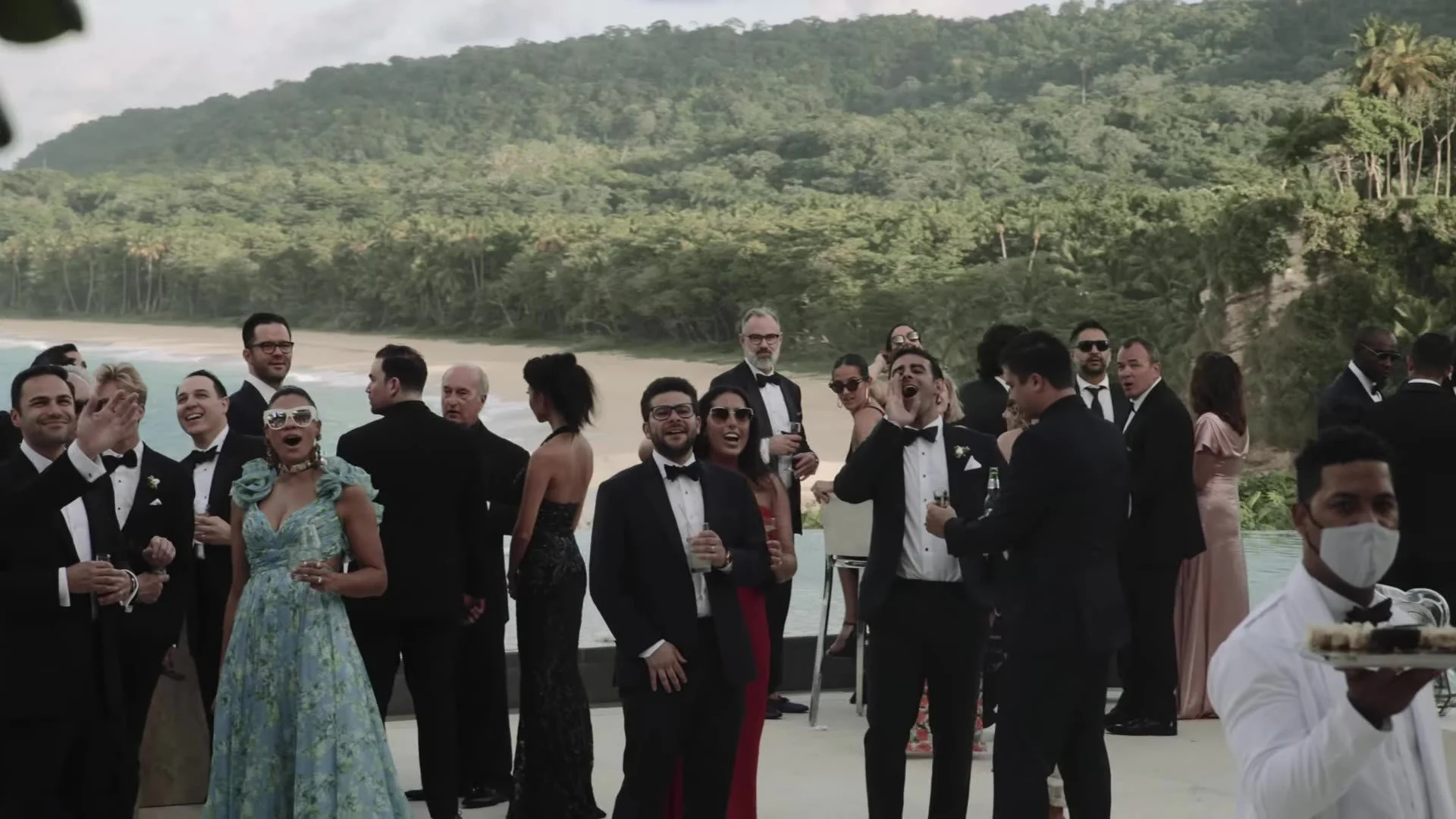 Cocktail guests on the coast with hills at Amanera Dominican Republic