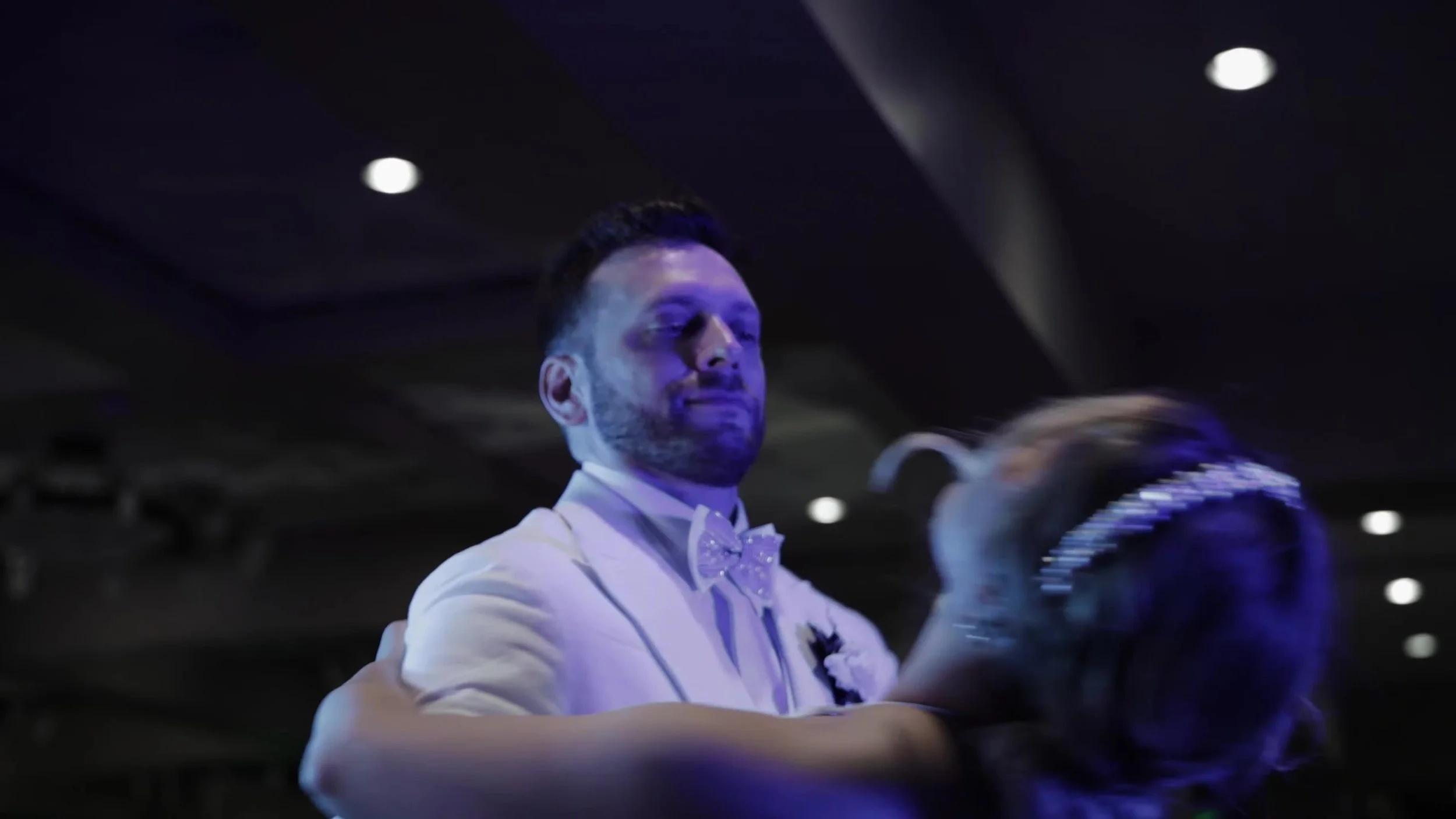 Jay smiling at Keely during their reception dance at Barton Creek Country Club in Austin