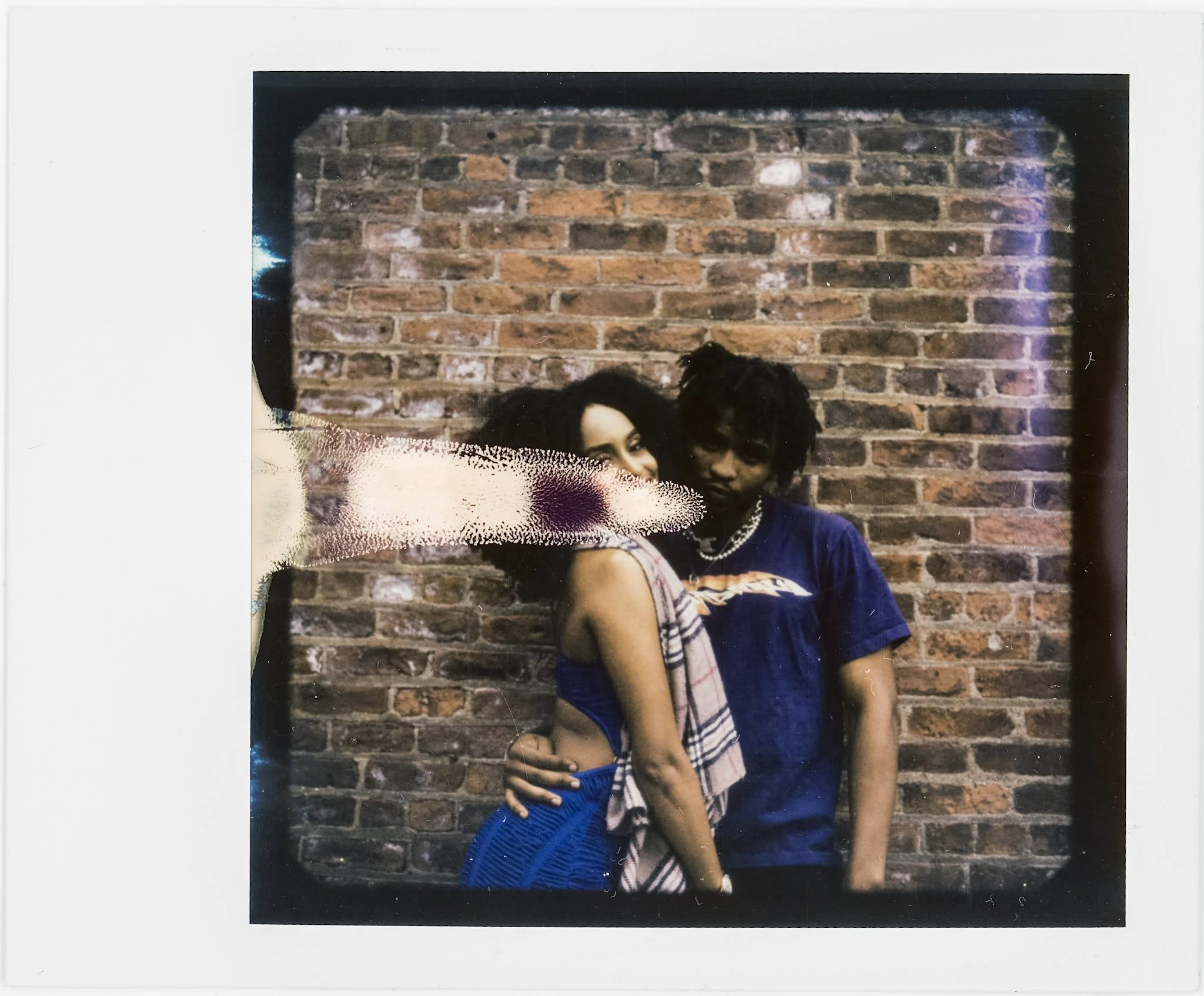 Black and white Polaroid selfie with sunglasses