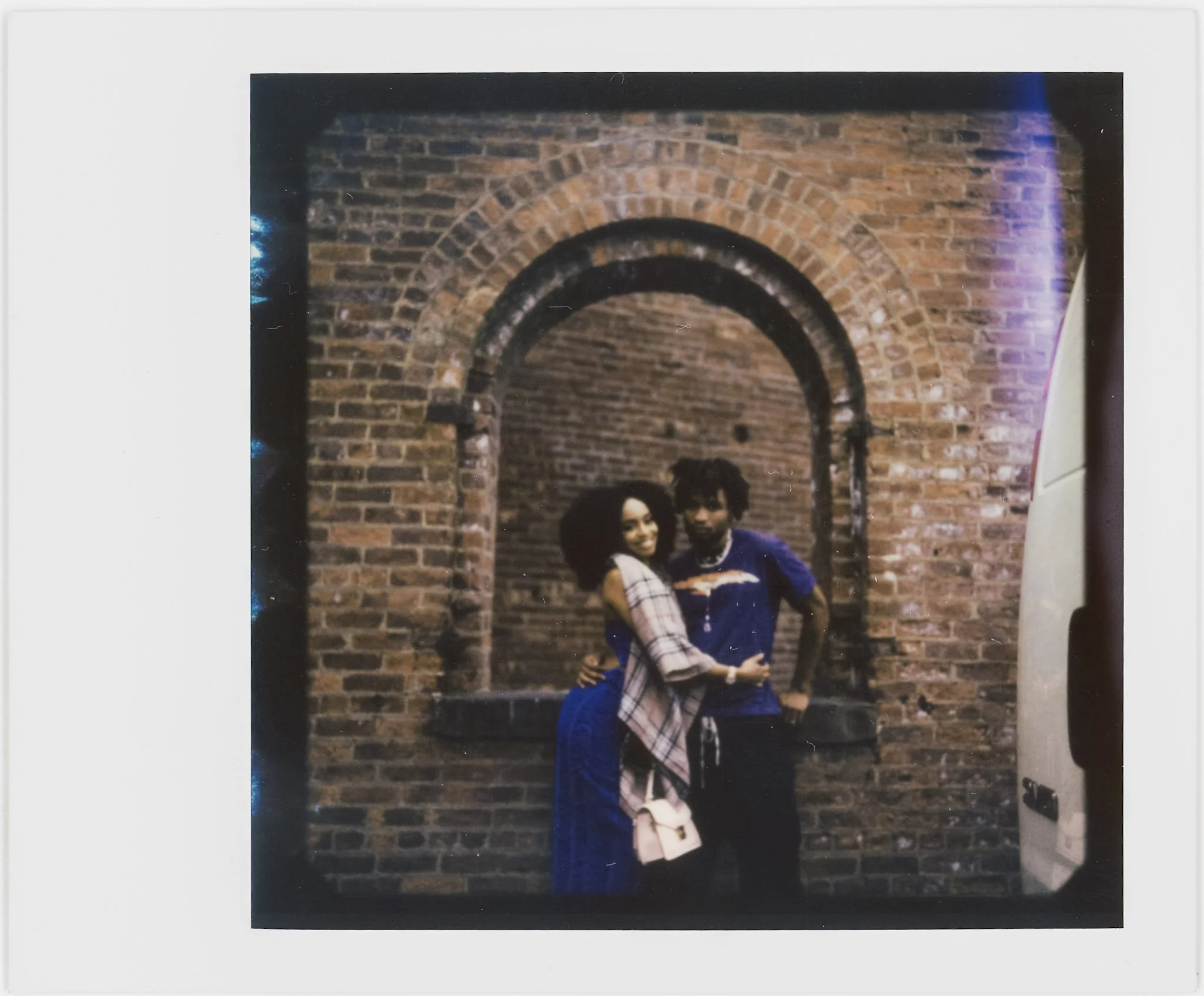 Polaroid rooftop portrait with pastel sky