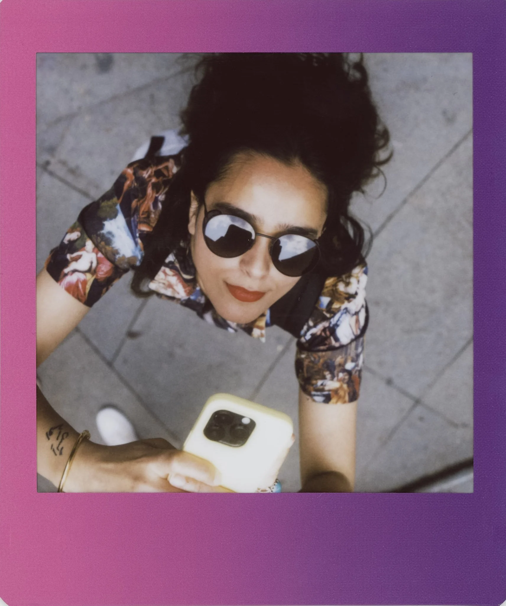 Instax wide of a photographer in soft blue tones