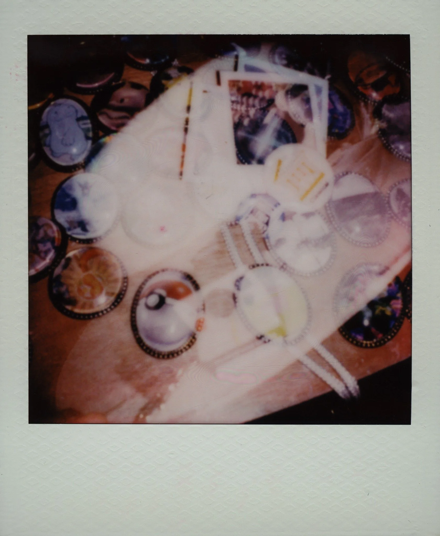 Small artworks and keepsakes arranged across a table