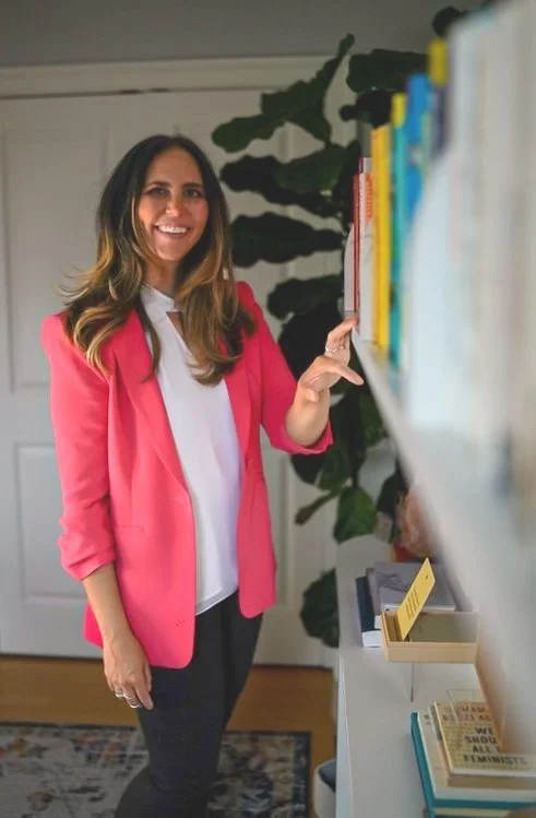 Coral Edwards, founder of IMHMO, smiling in her home office