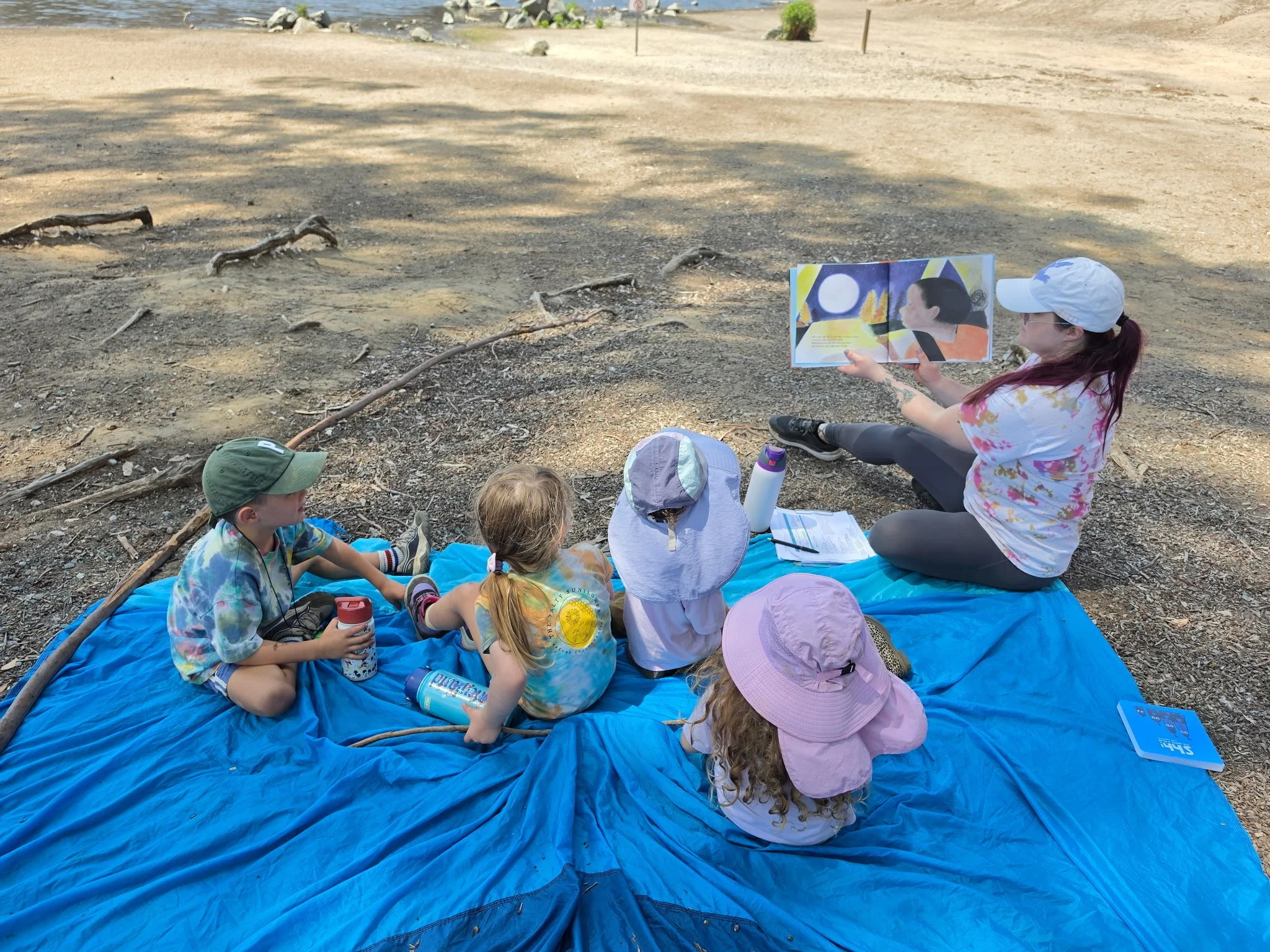 An educator working with children outdoors