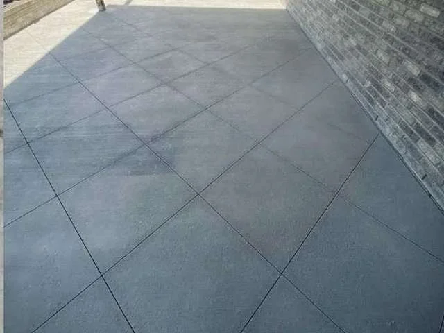 Stamped concrete with a slate pattern and charcoal release by Colorful Concrete LLC in Greeley, Colorado
