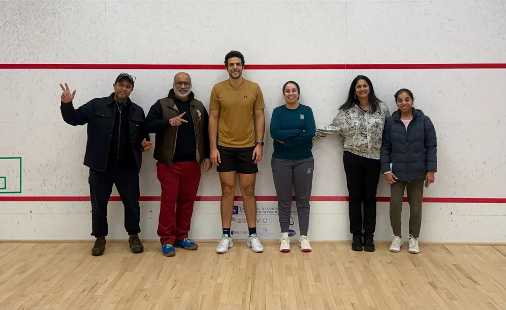Omar Mosaad with members of the Monmouth squash community