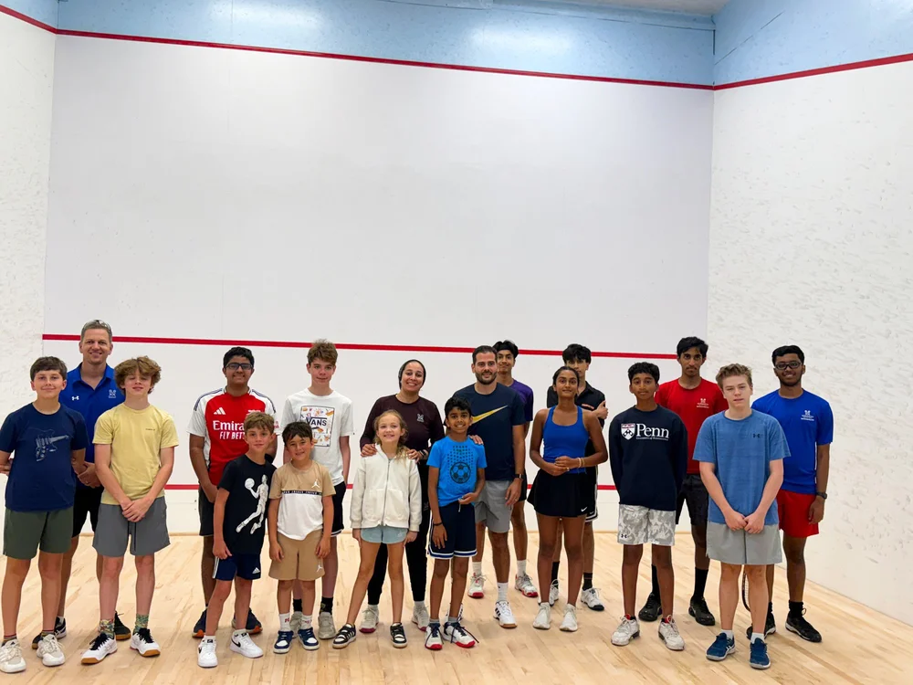 Karim Abdel Gawad with juniors and coaches at Monmouth Squash & Swim