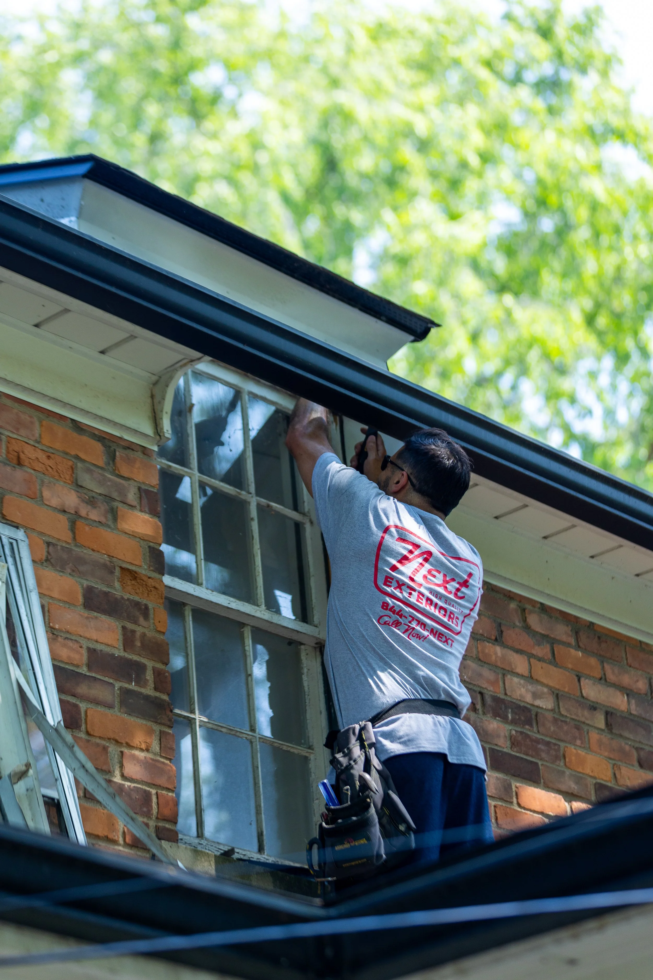 Next Exteriors crew working on a home in Metro Detroit Michigan