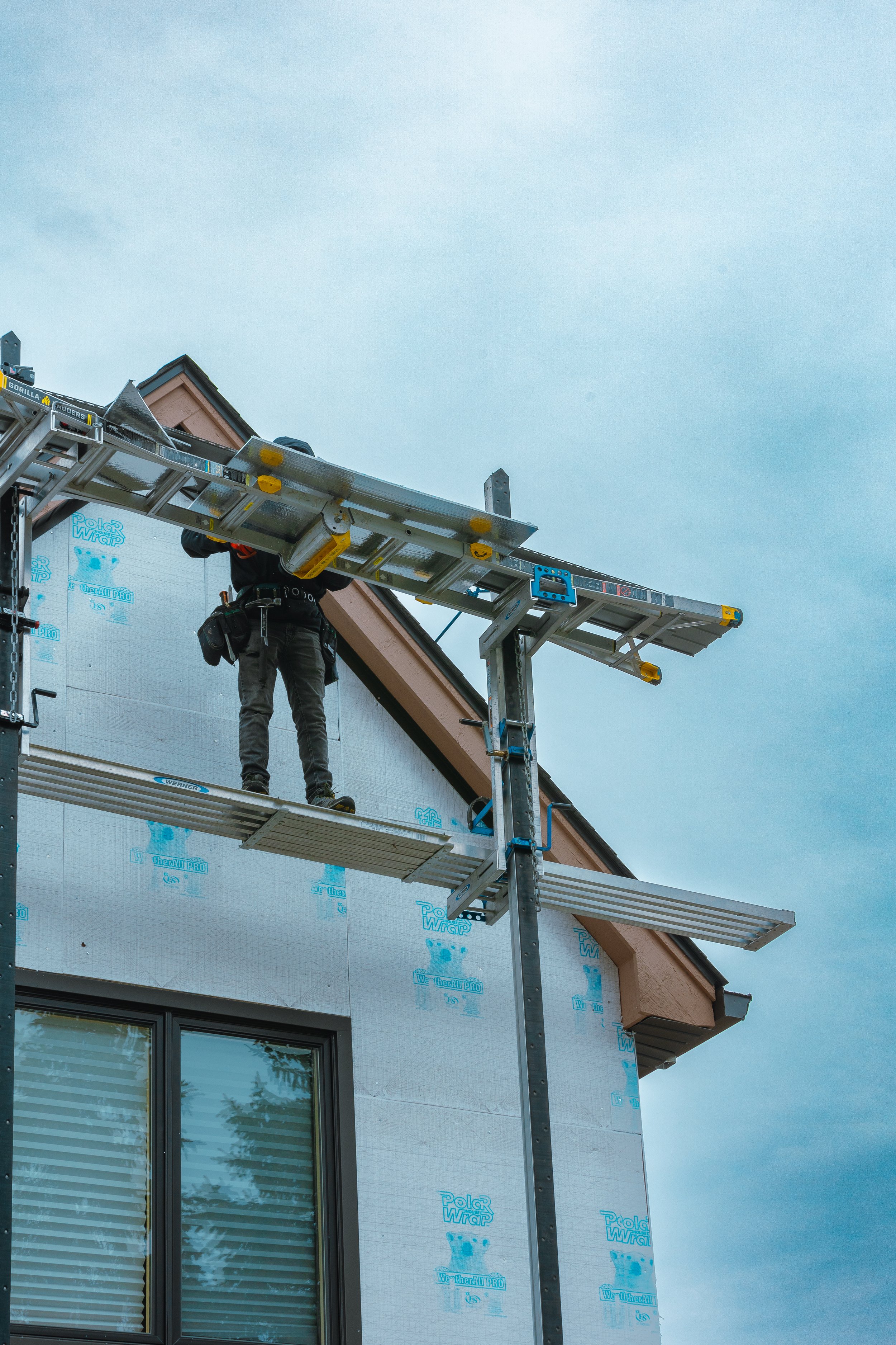 Siding repair work by Next Exteriors crew in Metro Detroit