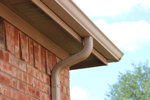 New vinyl gutters on Detroit Michigan home
