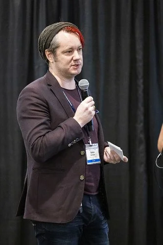 Quinn Nicholson speaking at an event
