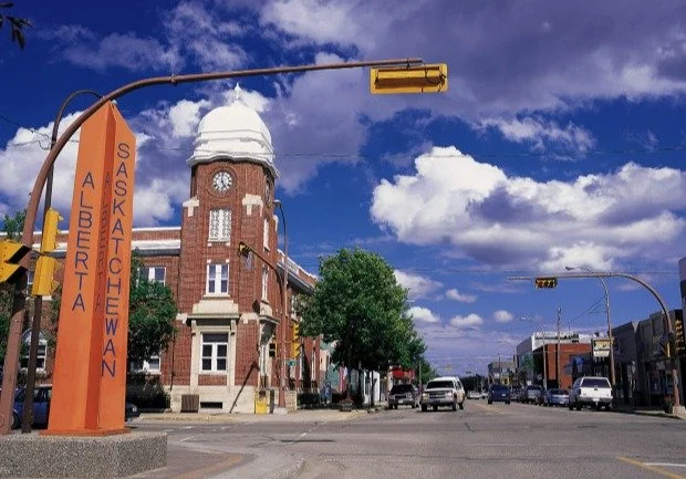 Alberta and Saskatchewan border marker and a downtown clock tower in Lloydminster
