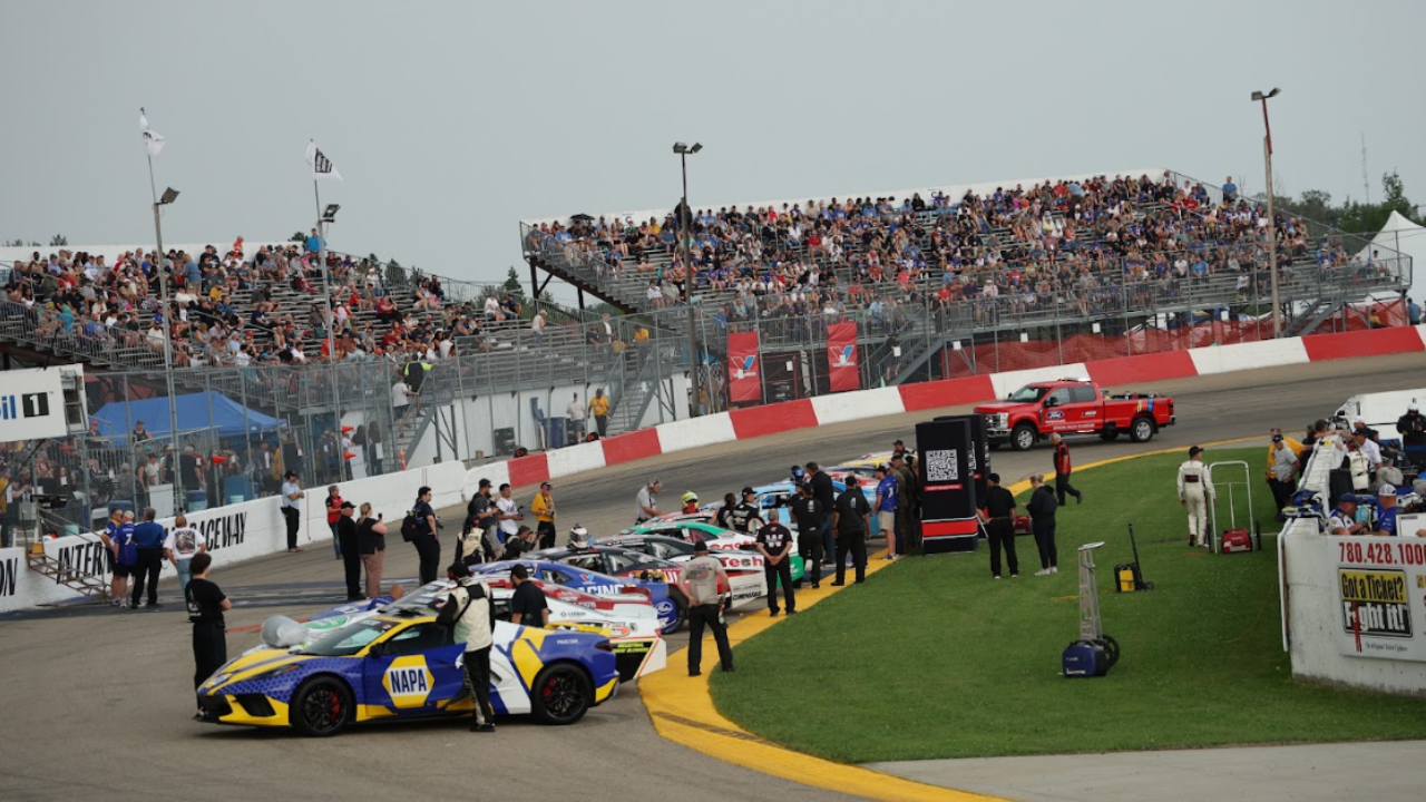 Race cars and a full grandstand at the race track in Wetaskiwin
