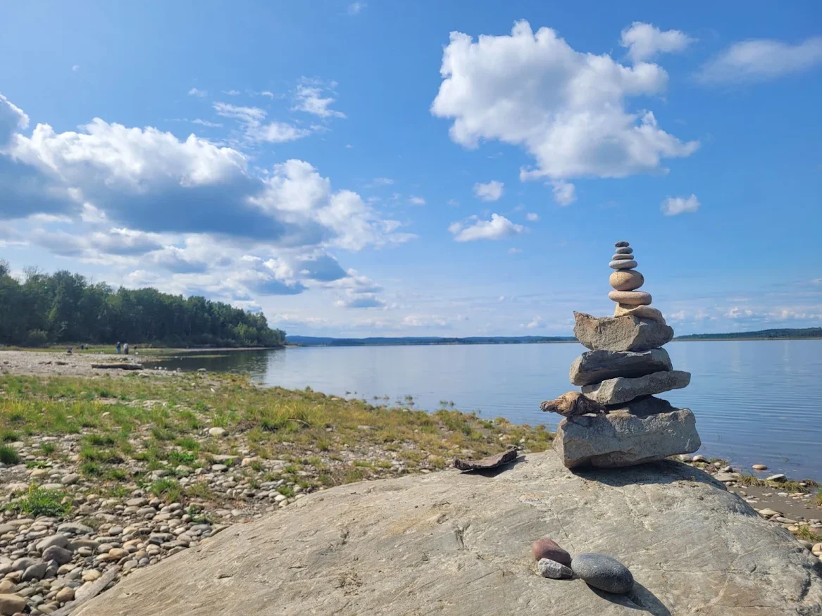 Stacked rock cairn on a shoreline near Drayton Valley