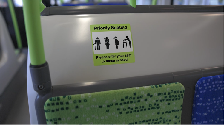 Priority seating sign mounted above a seat inside the LRT vehicle