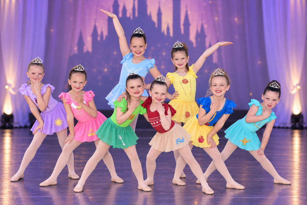Young dancers in colorful princess-themed costumes