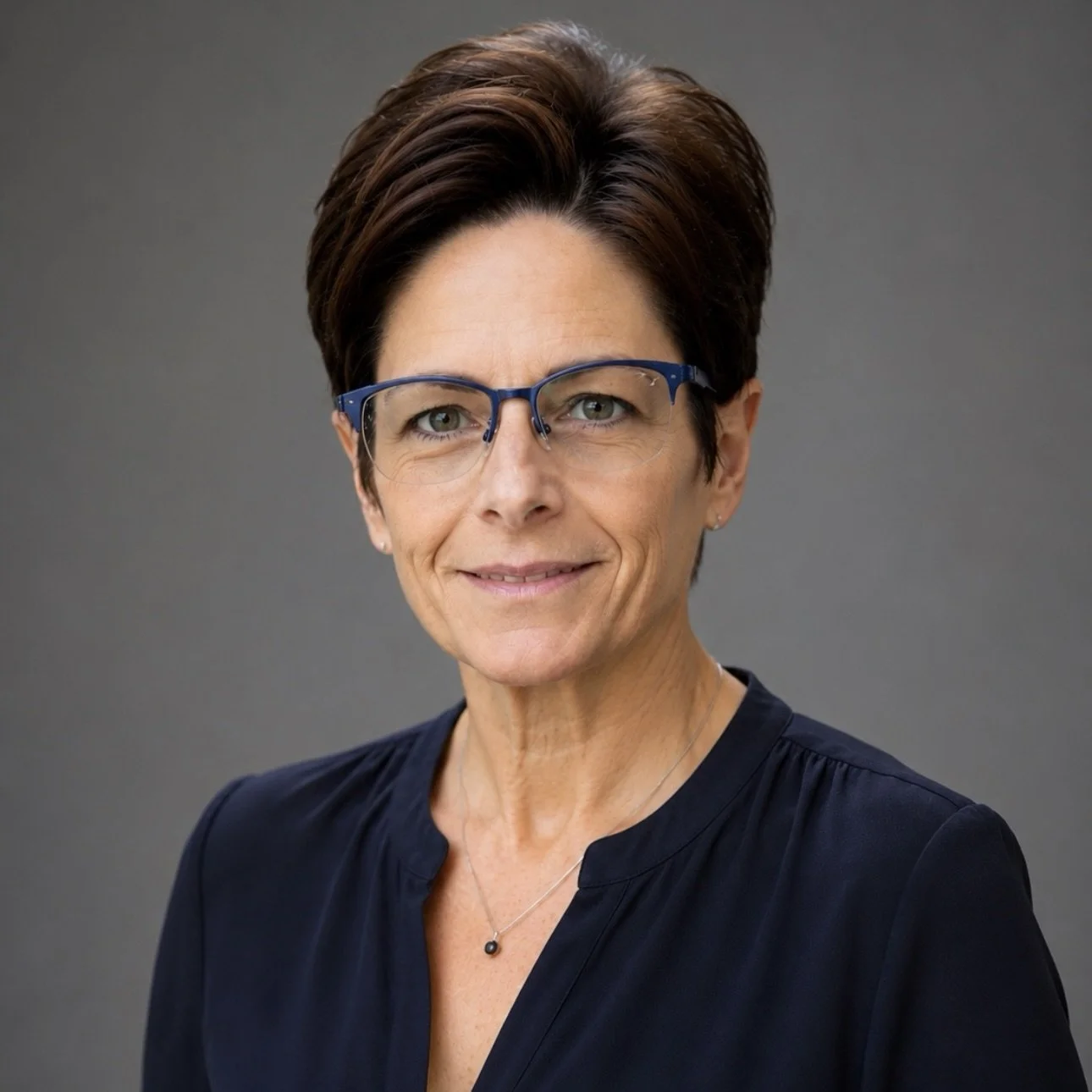 Headshot of Laura Simonson, ACMHC, Therapist at Beehive Mental Health.