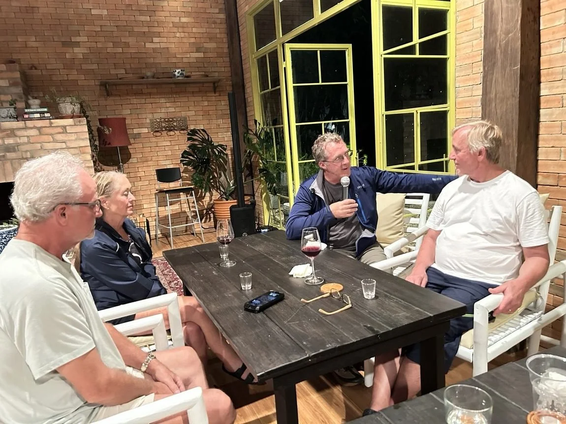 A guest shares his story over dinner