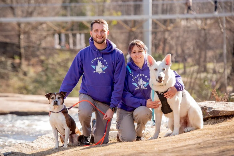 The Complete K-9 team with their dogs