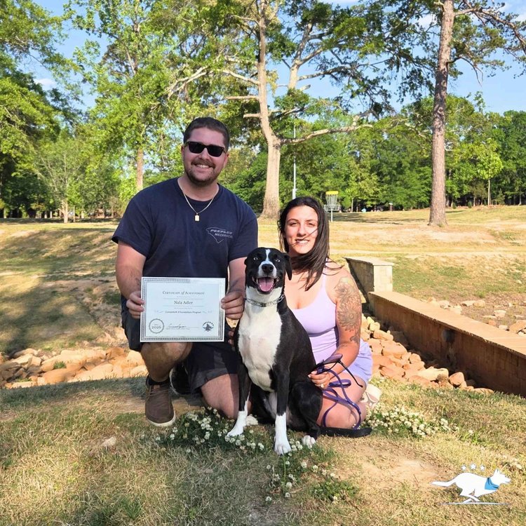 A family celebrating graduation with their dog