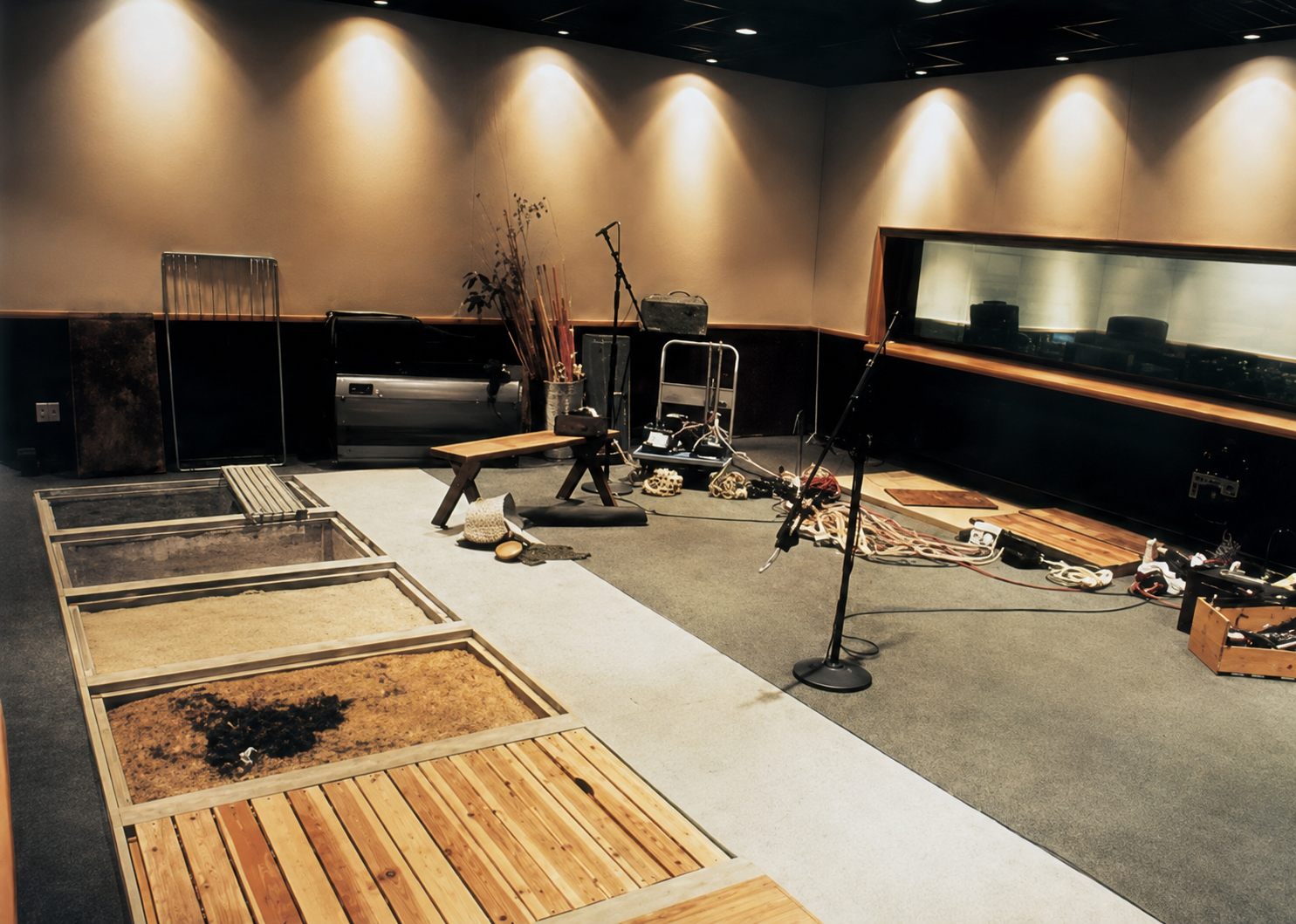 Studio City Foley stage with multiple performance surfaces and a recording position.