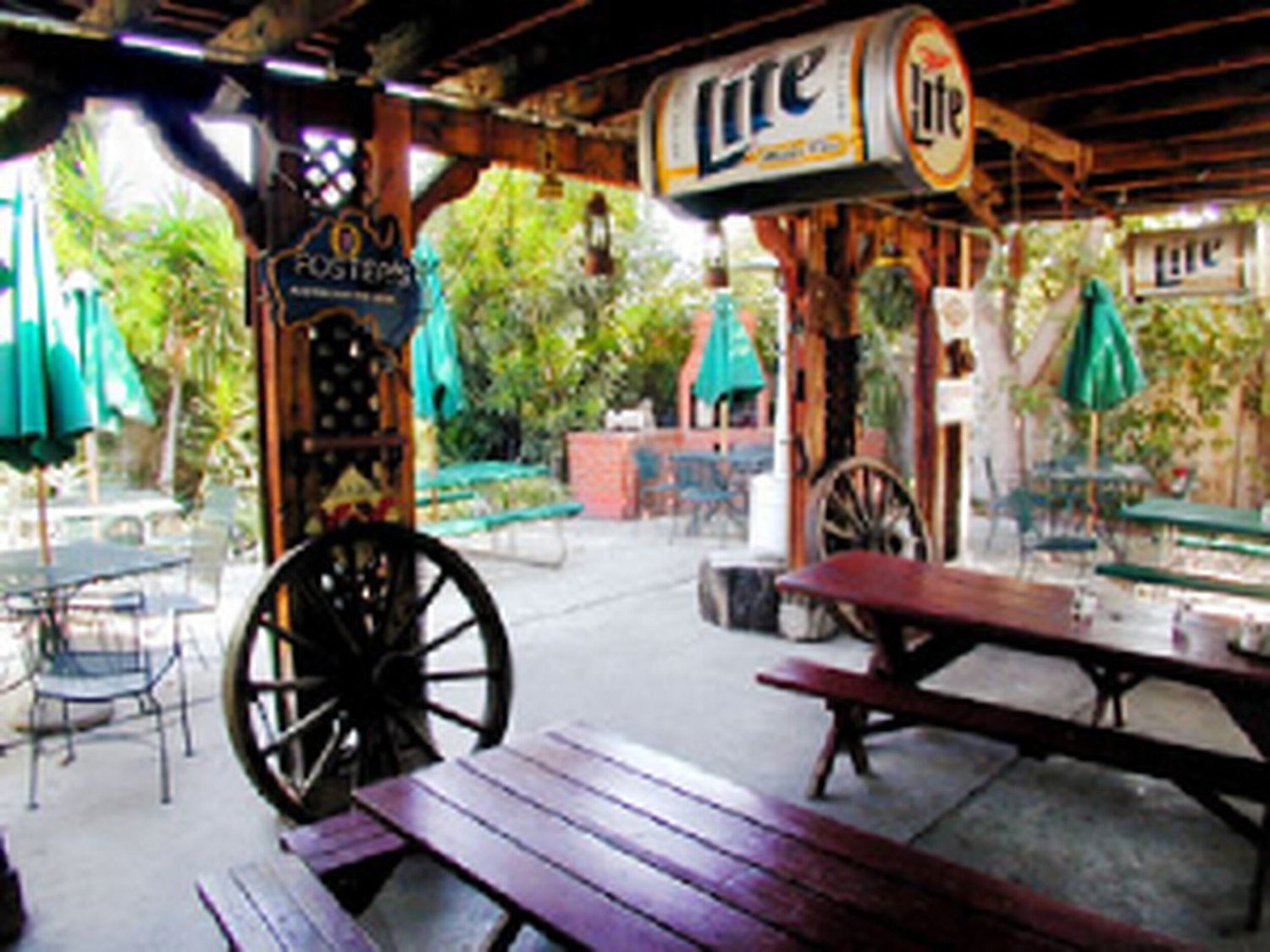 Burbank bar and grill patio with fireplace, mature landscaping and live-venue character.