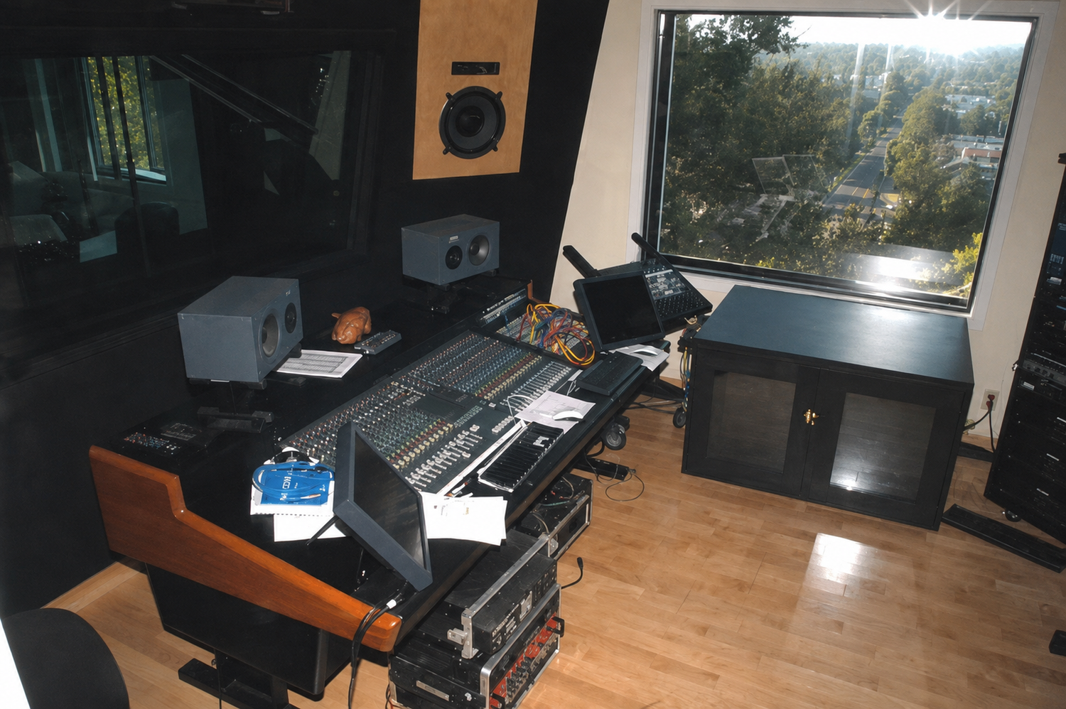 Studio City Hills home recording control room with console and neighborhood view.
