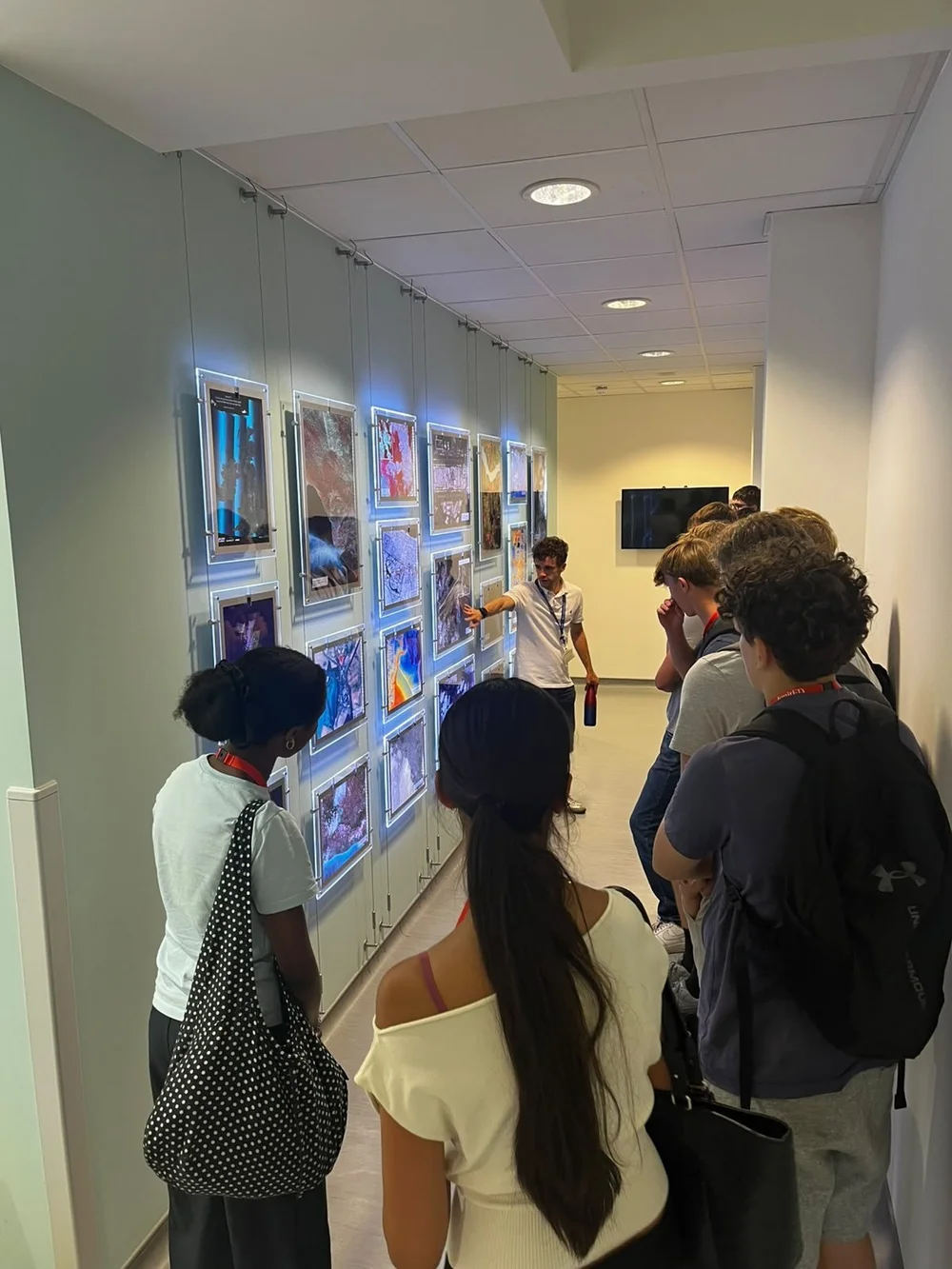Participants looking at an exhibition of work