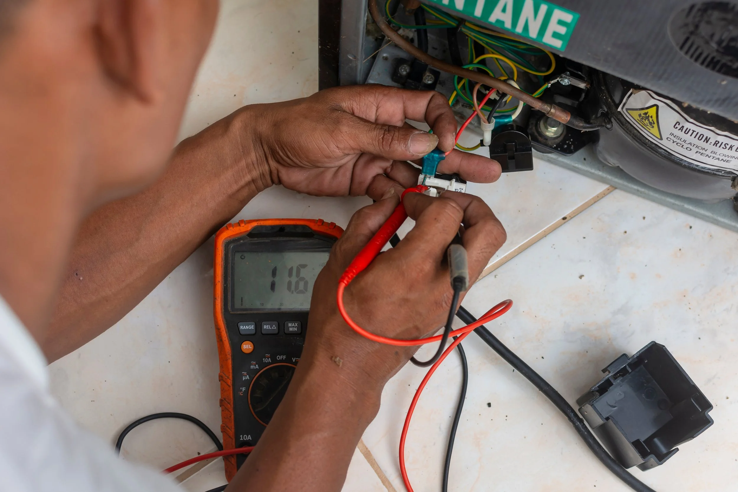 Technician inspecting refrigeration equipment