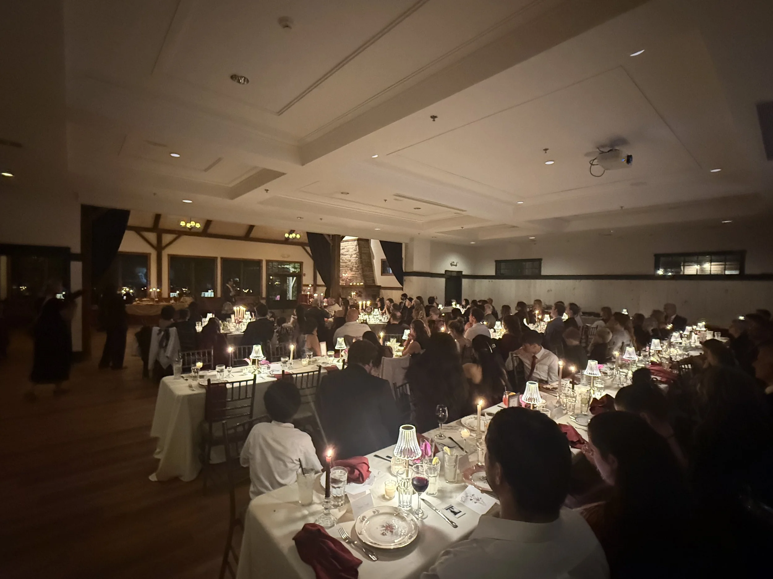 A reception dinner set on long tables