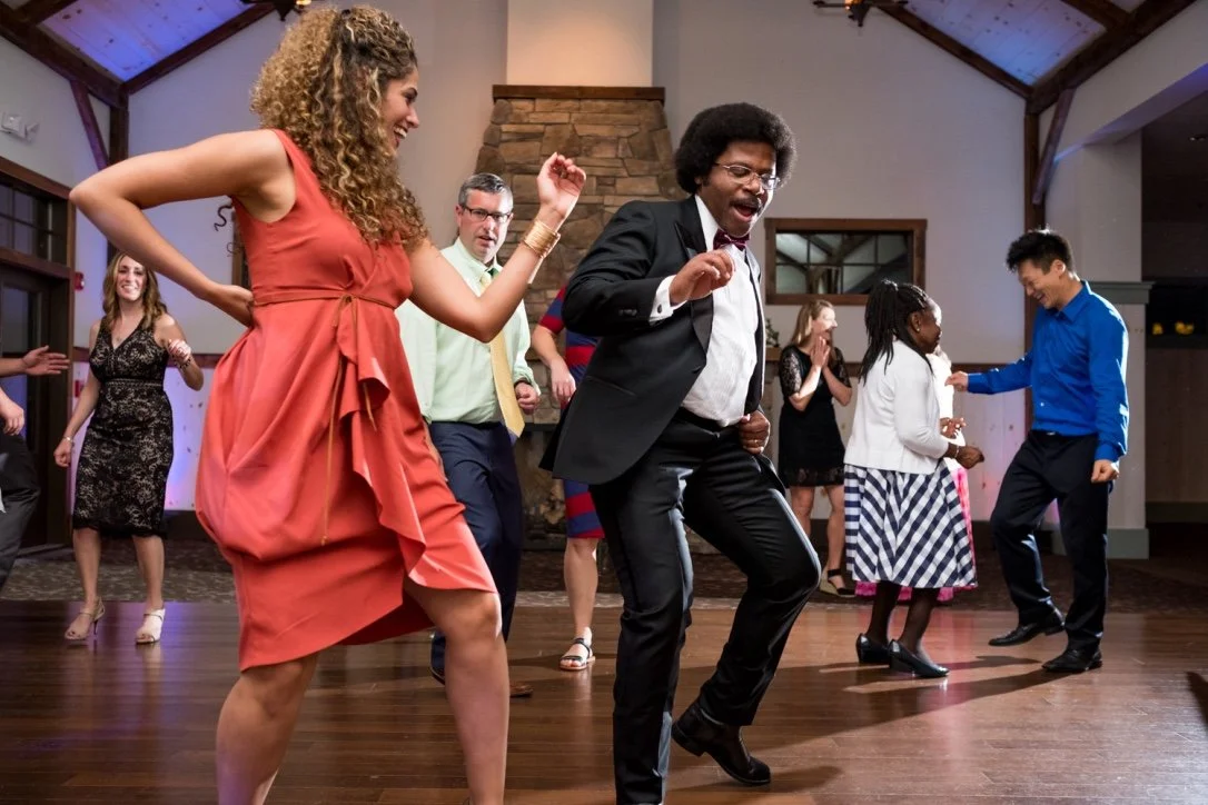 Wedding guests dancing in the A-frame hall
