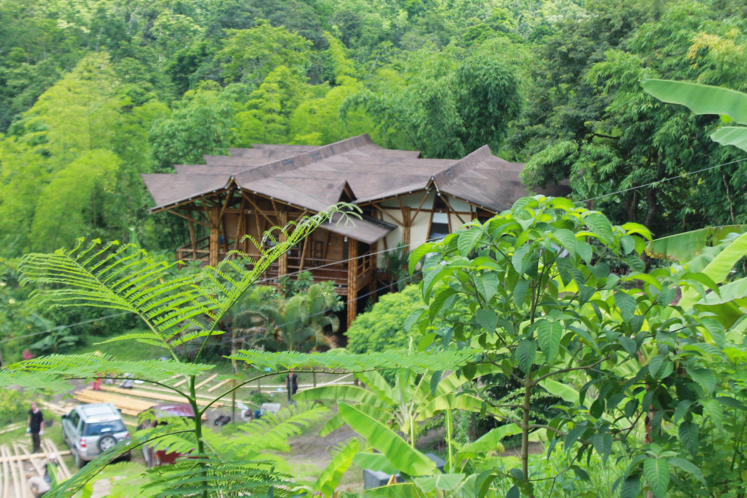 Wide aerial view of Los Arboleros Farm and the surrounding landscape in Chone.