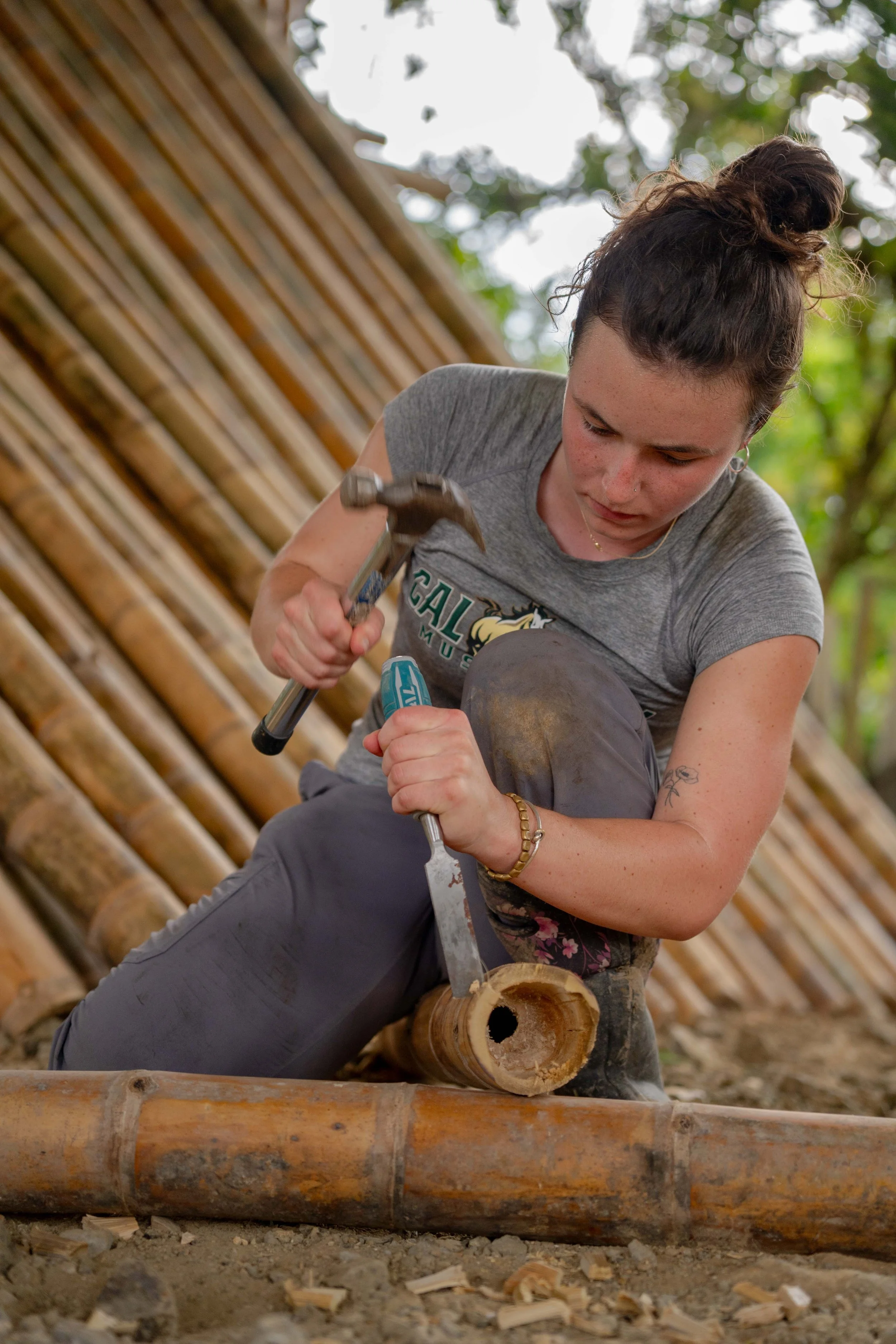 Participants completing applied bamboo education and construction work.