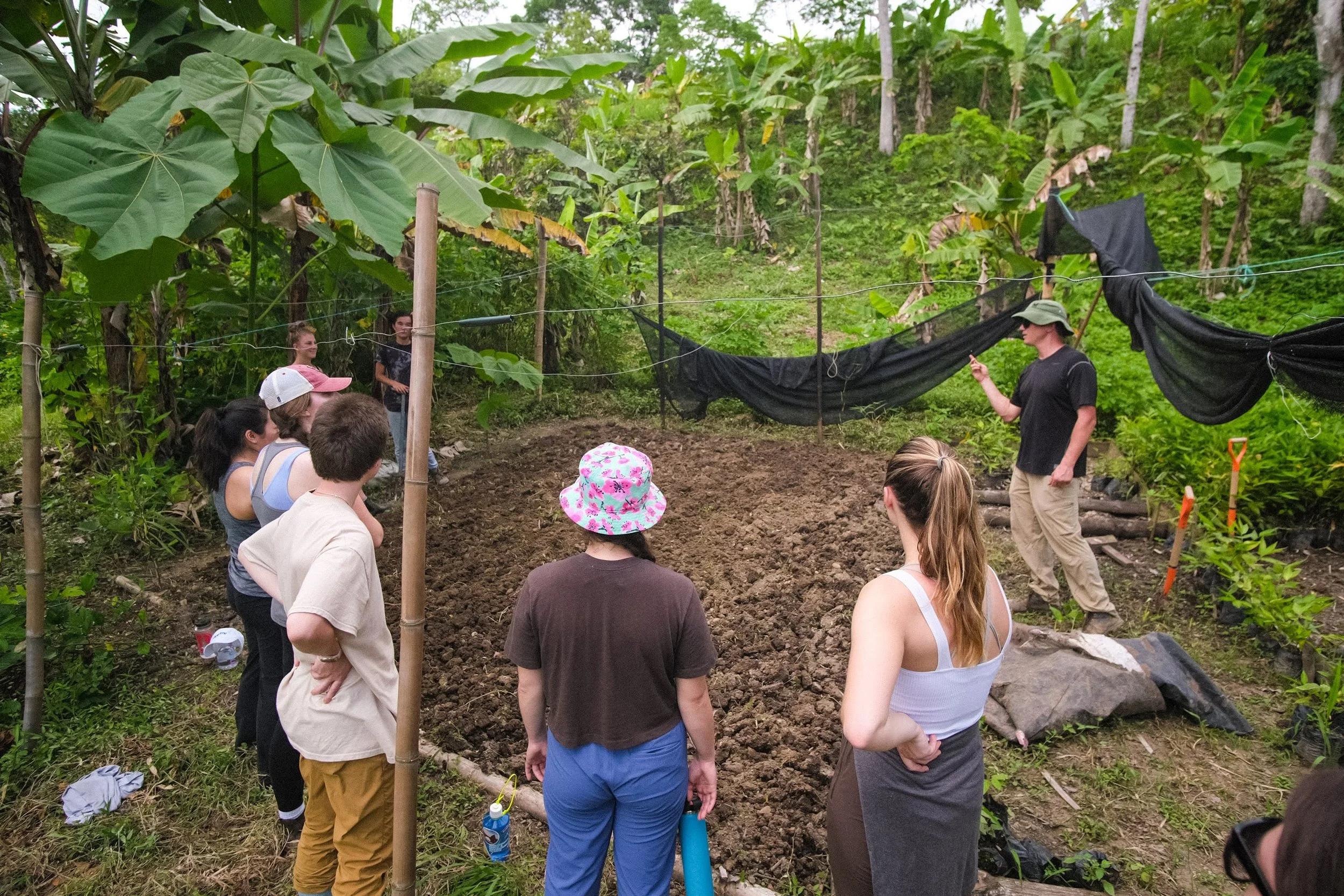 RFI participants working with an instructor during a bamboo workshop.