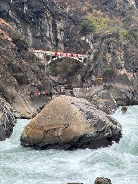 The Jinsha River surges around a boulder in Tiger Leaping Gorge.