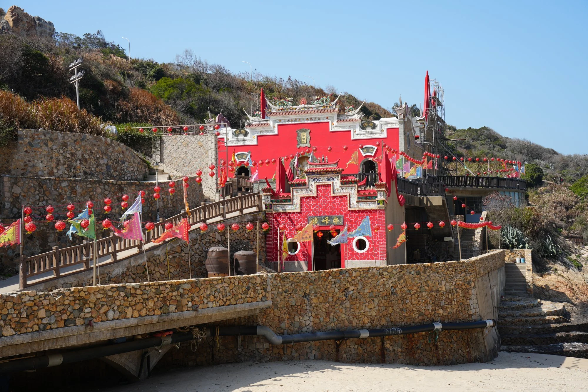 Red walls, flags and lanterns brighten Niufengjing Wulinggong Temple on Nangan.