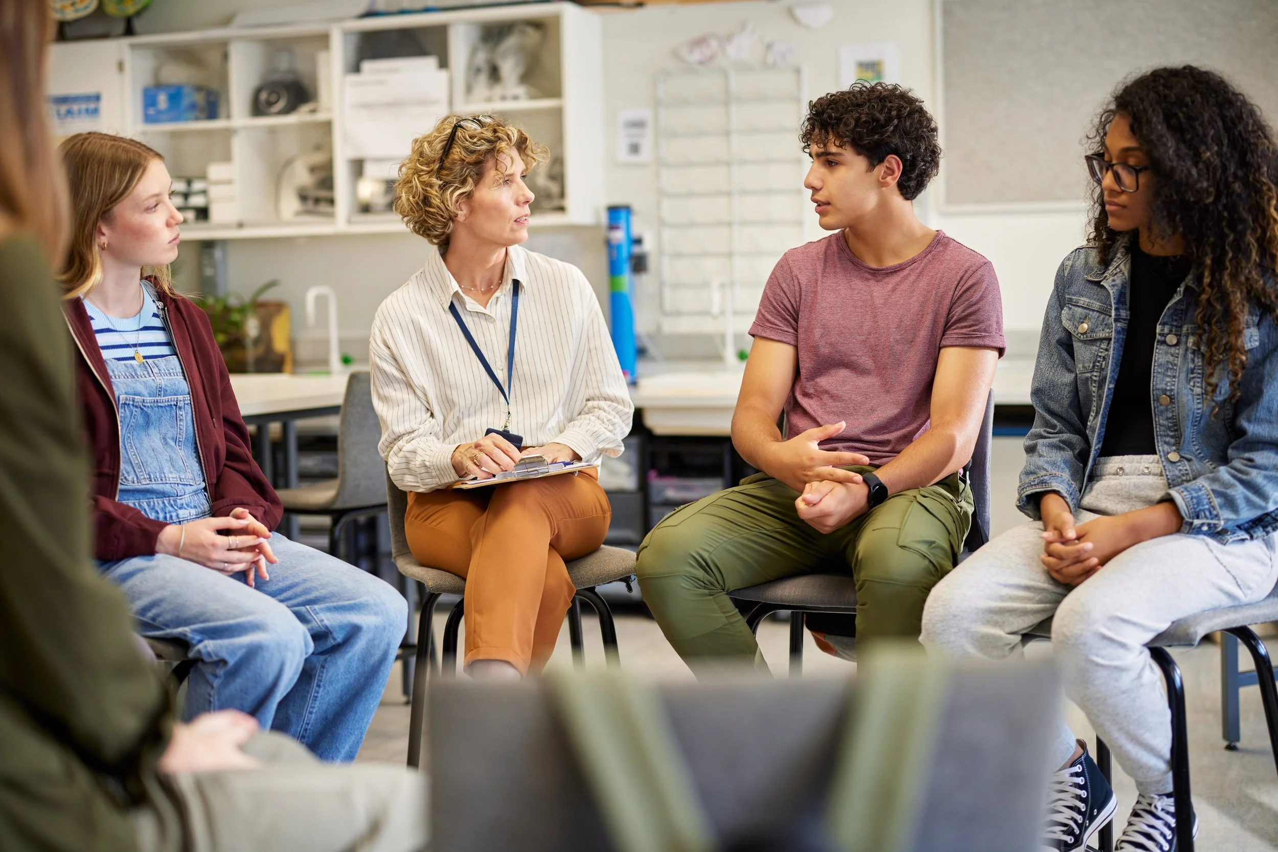A facilitator guiding a relationship circle