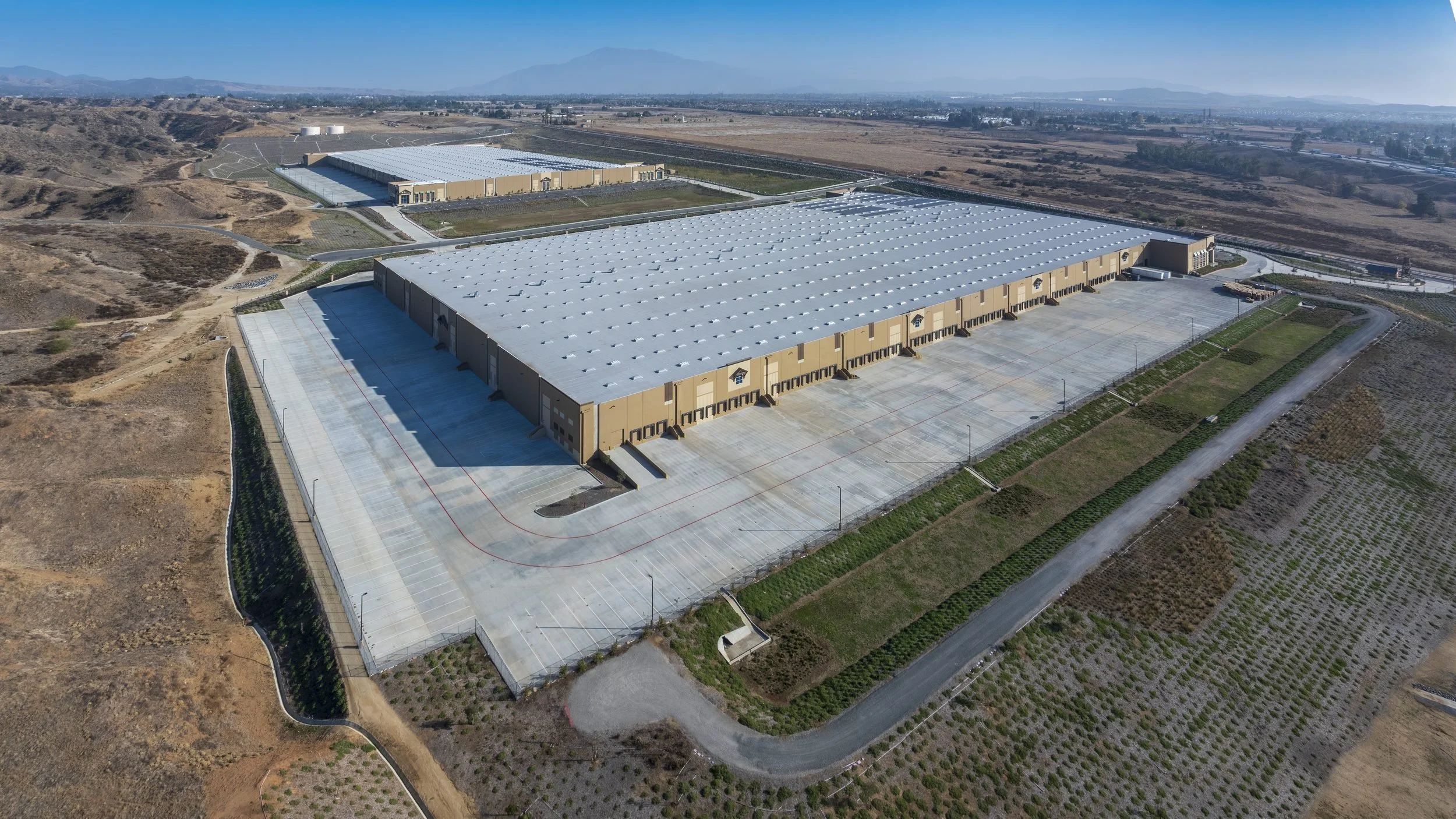 Drone view of a warehouse roof and loading docks for a facility inspection