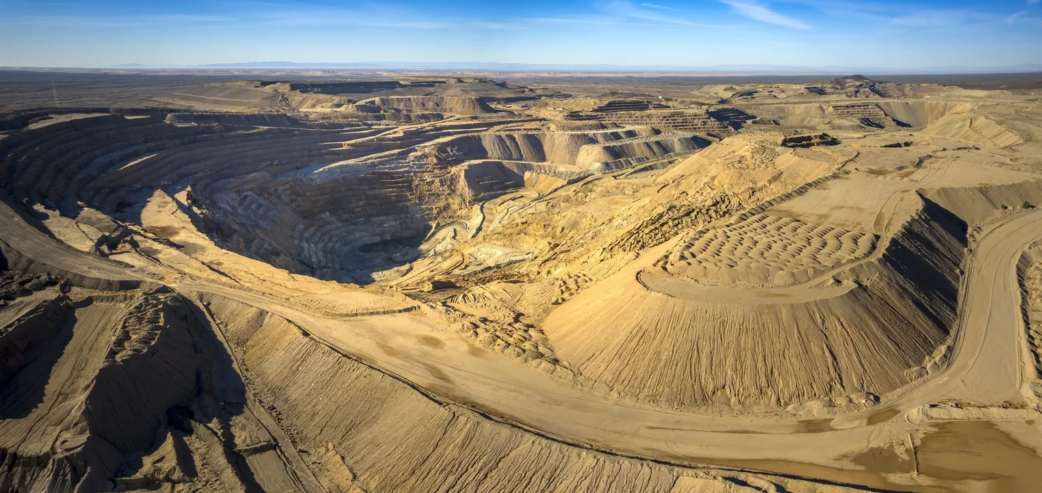 Drone aerial of open-pit mine terraces in the desert