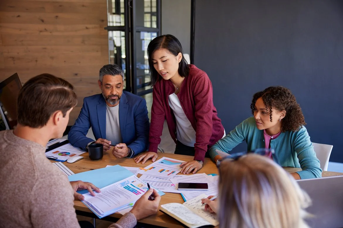 Leaders collaborating around a table
