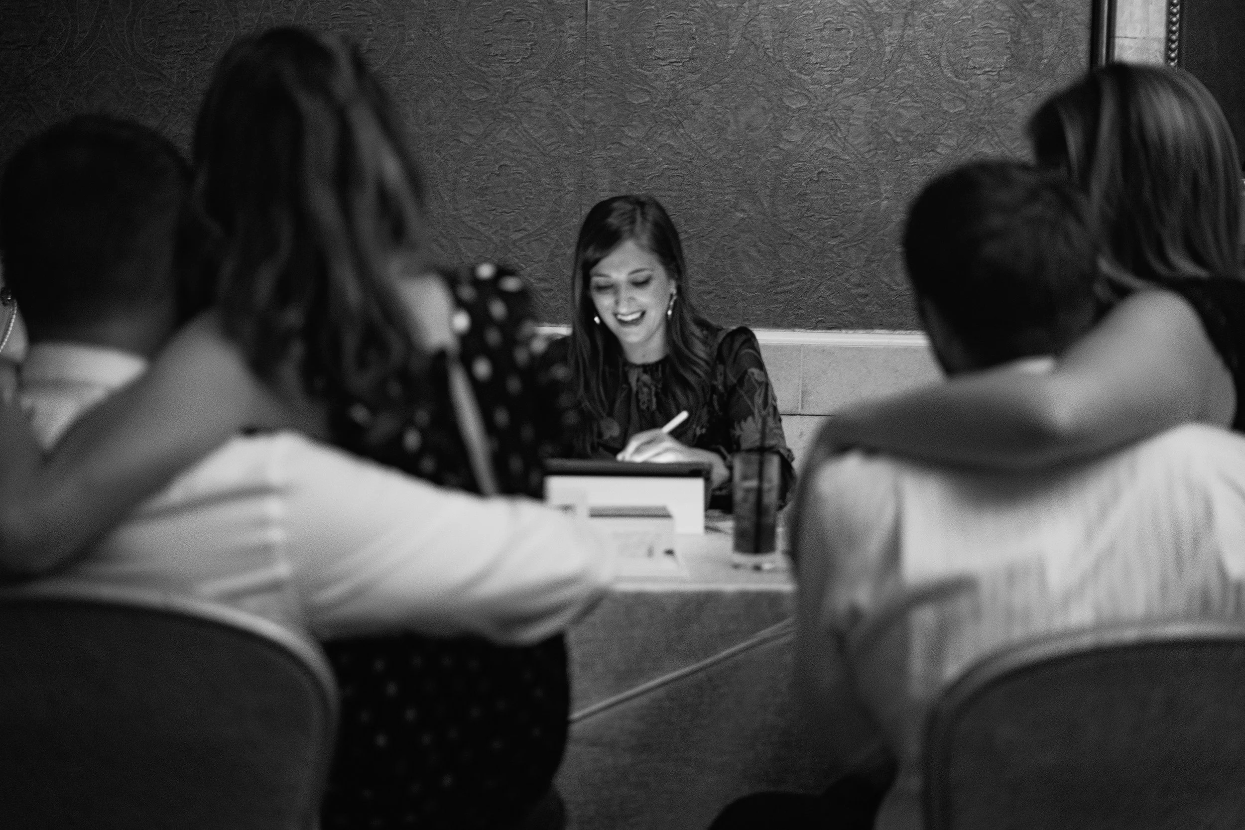 Live event illustration — artist drawing guests at a cocktail hour