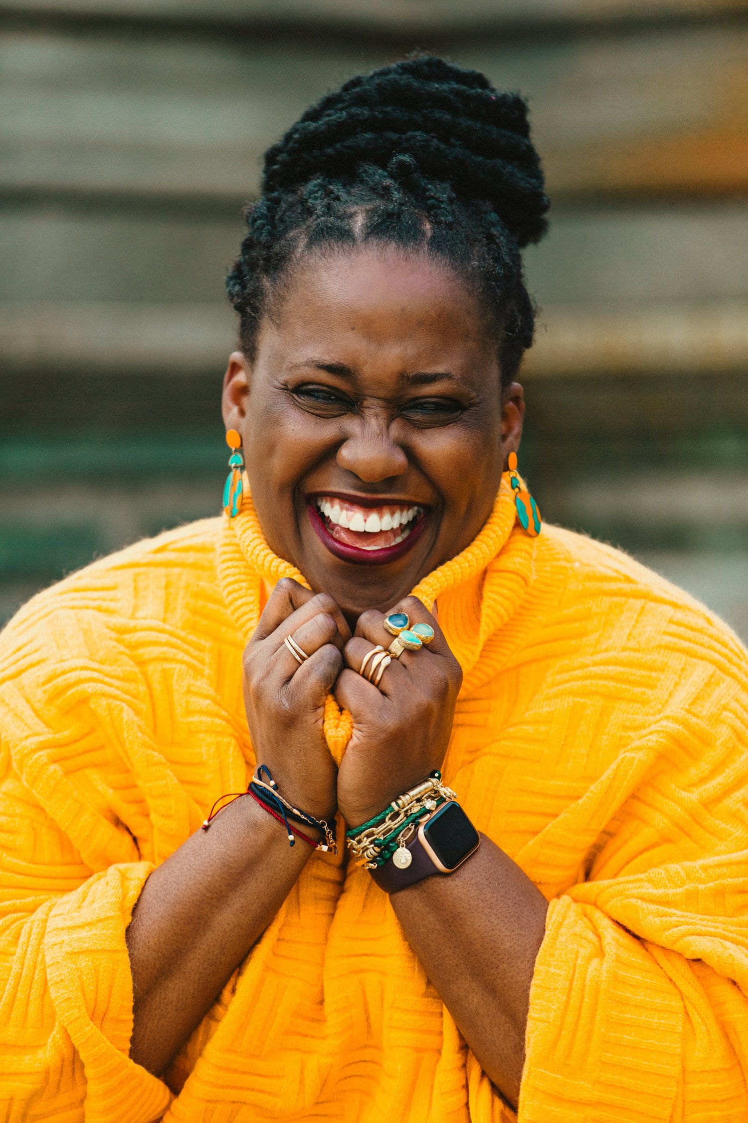 Timi Phillips seated at a table, looking towards the camera
