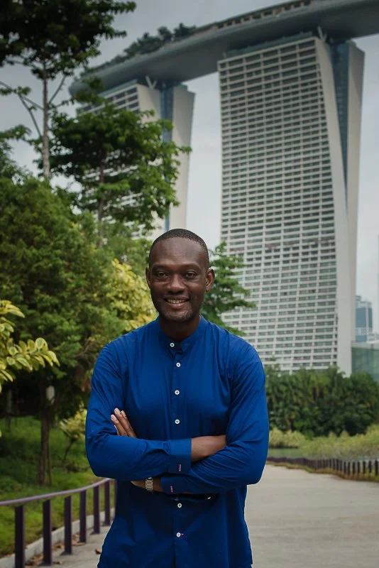Rudi Doku, executive coach and Somatic Experiencing Practitioner, in Singapore with Marina Bay Sands behind him