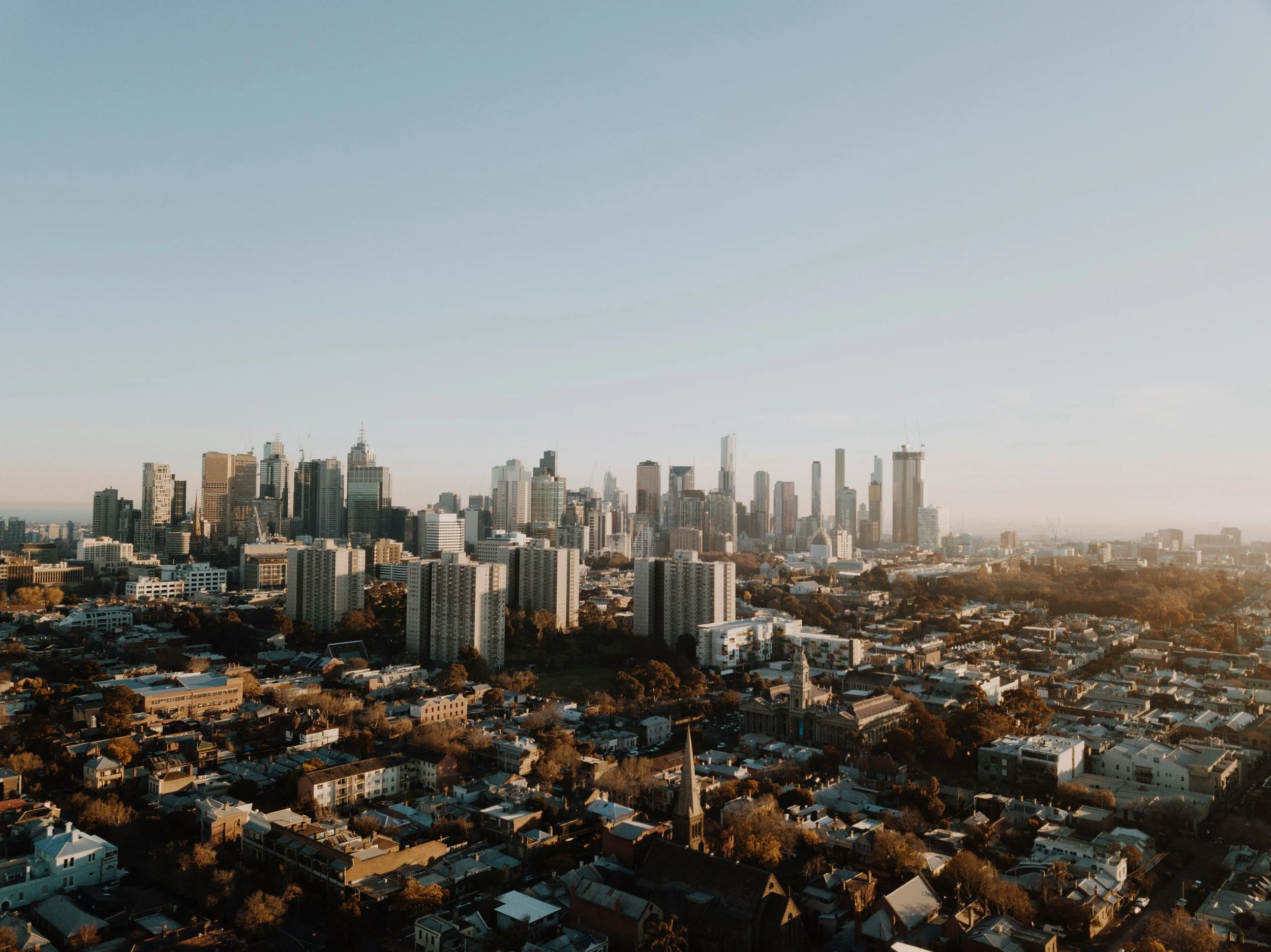 Melbourne city skyline on a clear day, leadership coaching with Rudi Doku