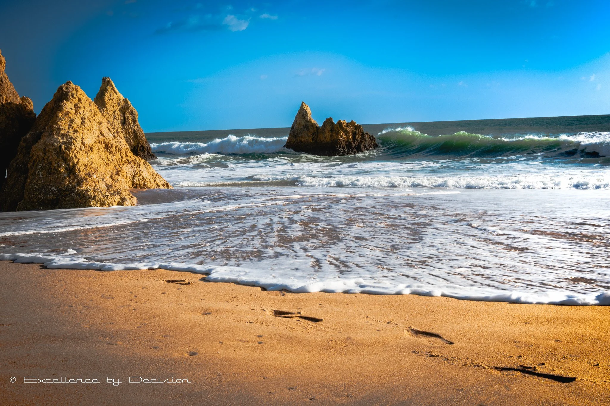 Three Brothers Beach in Alvor Algarve with rock formations and calm waters