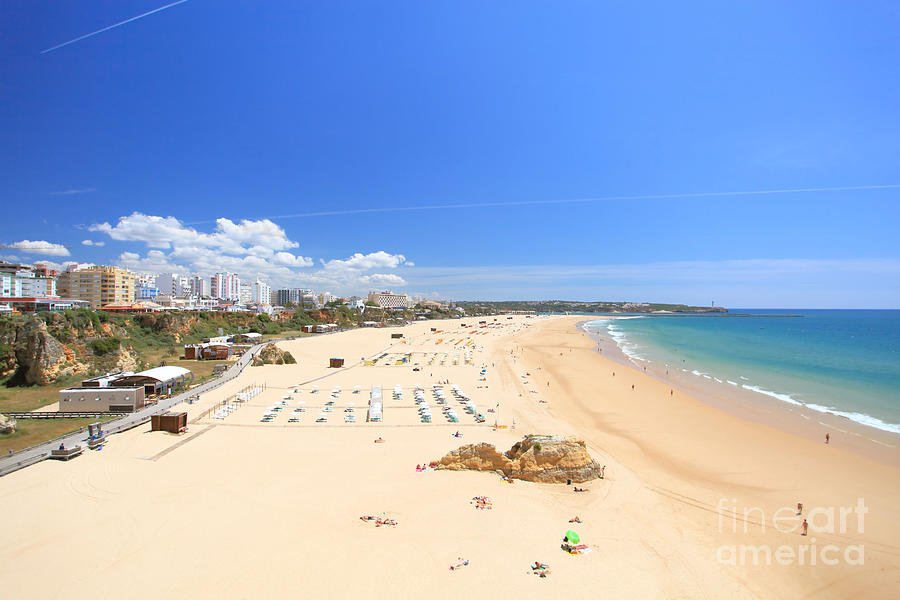 Rocha Beach in Portimão Algarve with wide sand and lively promenade