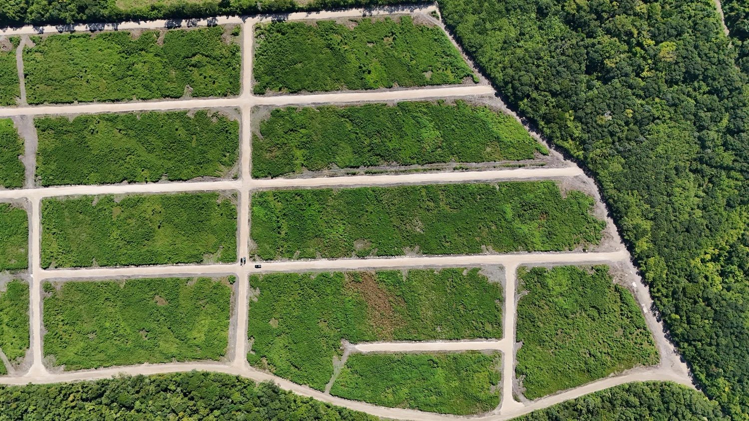 Overhead drone image of Phase 2 lots at Coastal Vista with cleared boundaries and access roads